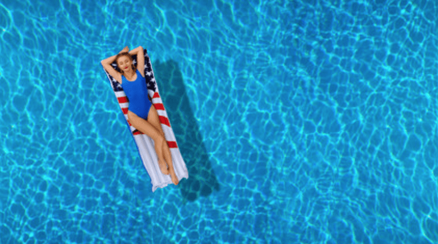 gal in a bikini relaxing in her clean pool maintained by bakersfields best